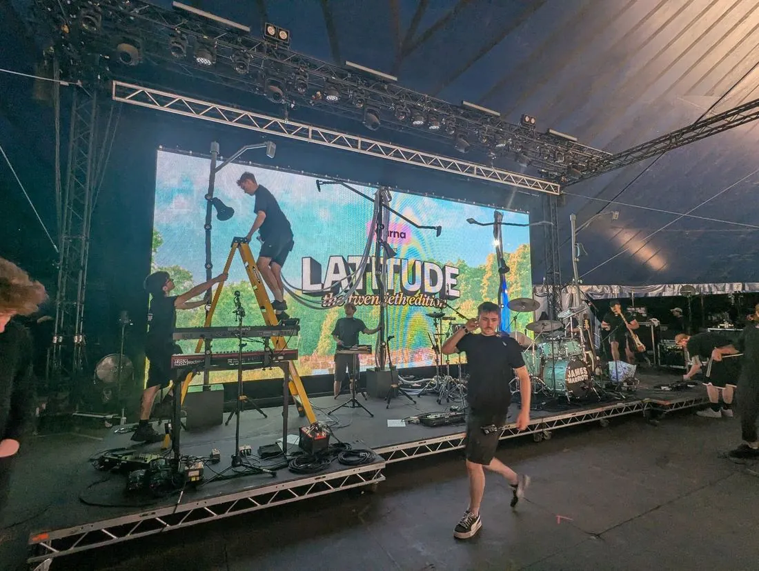 Crew setting James Marriott's stage during a changeover at Latitude 2026