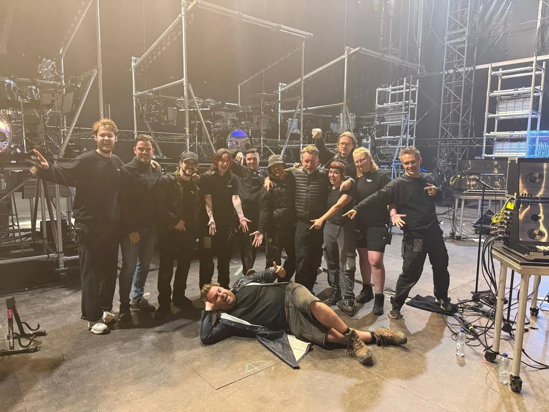 The Soulwax touring crew on stage in front of the drum risers
